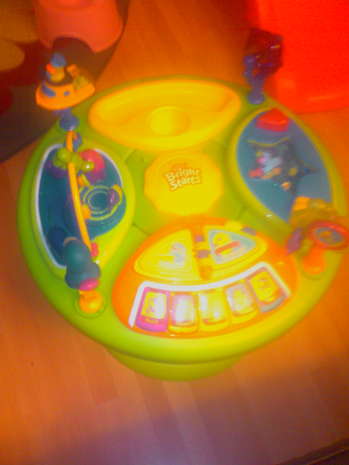 Bright Starts Tropical Fun Around We Go! Activity Station I purchased this activity center when my children were about 6 months old.  The moment we put Elle in it she...