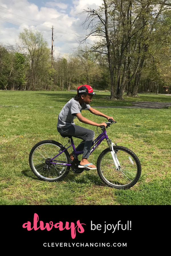 African American Child Riding a Bike-AD Always Be Joyful